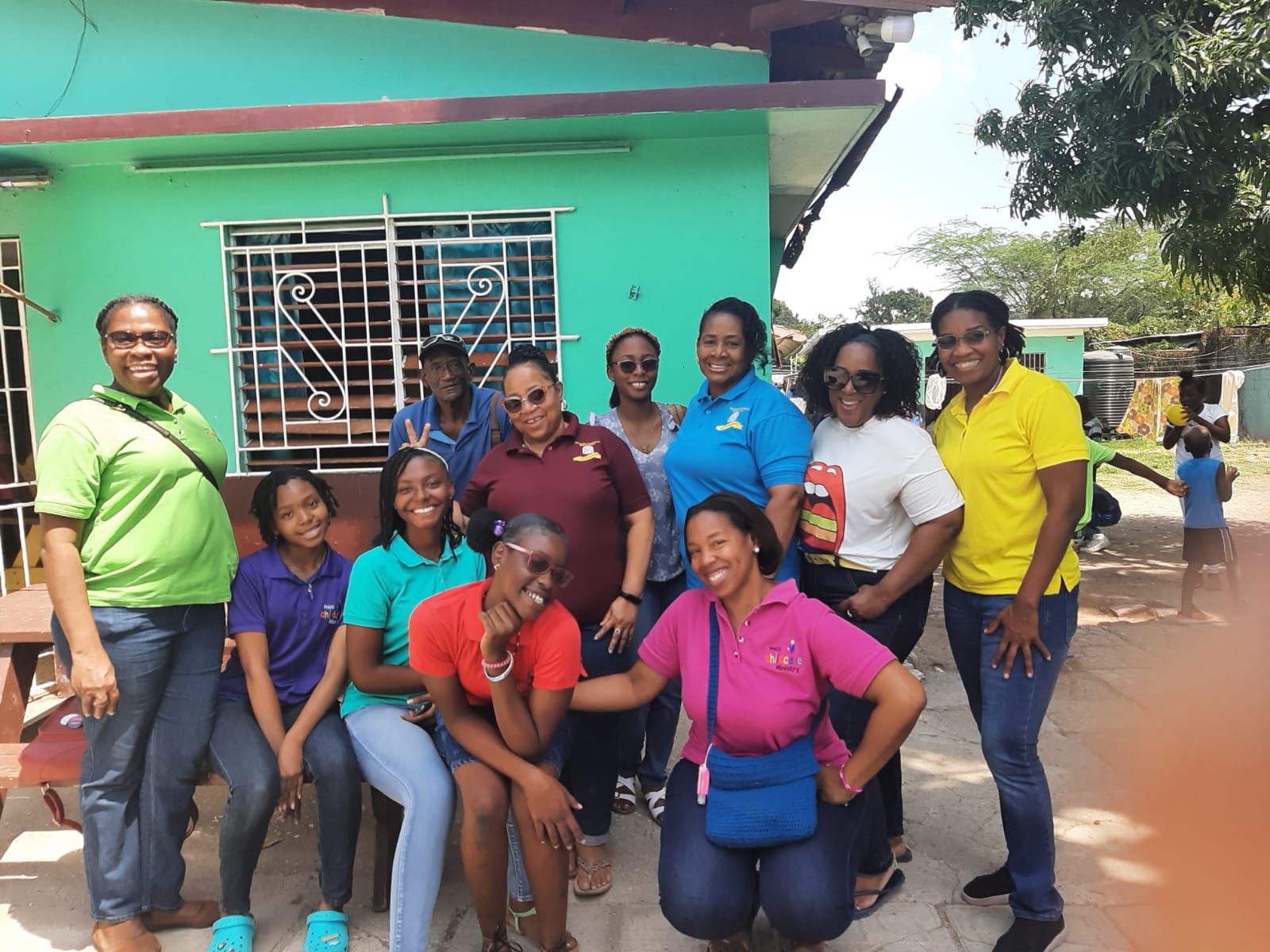 Childcare Ministry volunteers and young people at a community visit