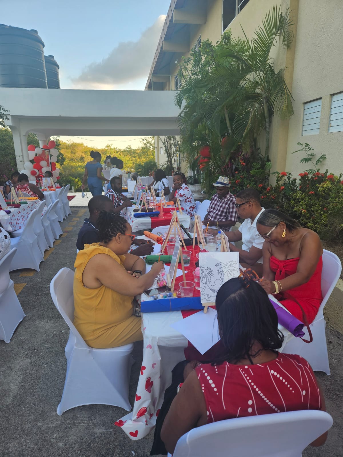 Couples painting together at an outdoor Marriage Ministry gathering