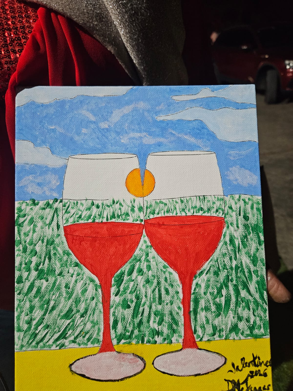 A completed painting of two glasses displayed at the couples' event