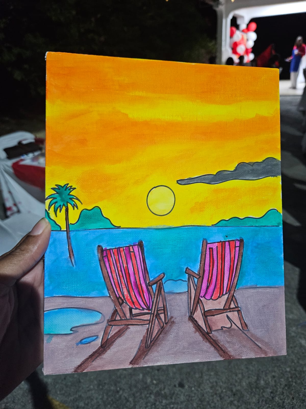 Painting of two chairs overlooking a sunset by the sea