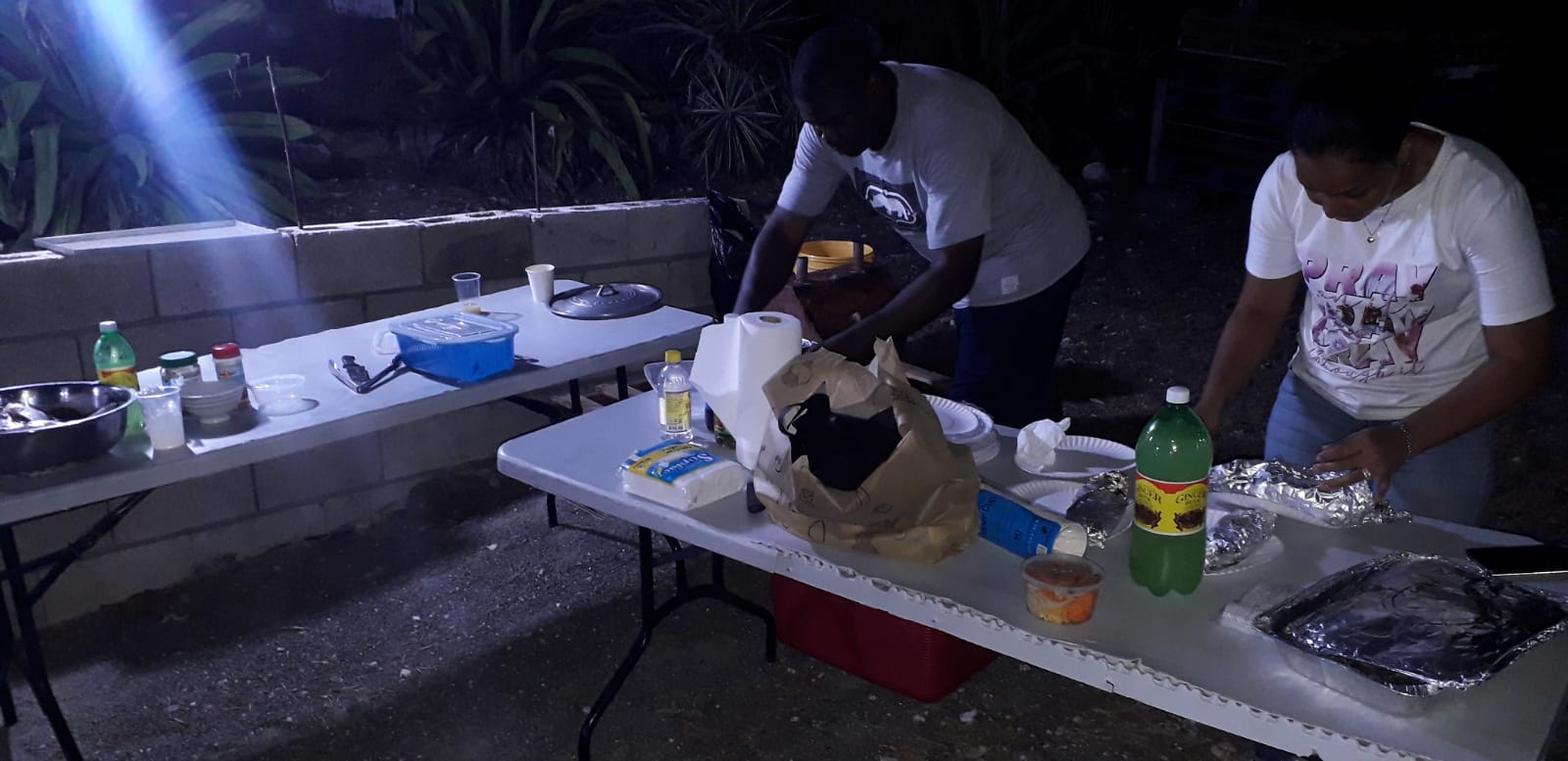 Volunteers preparing food for a Men's Ministry fellowship