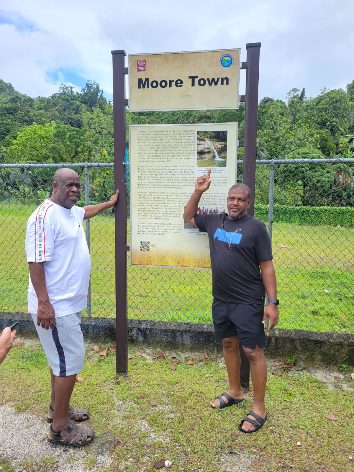 Men visiting the Moore Town heritage site