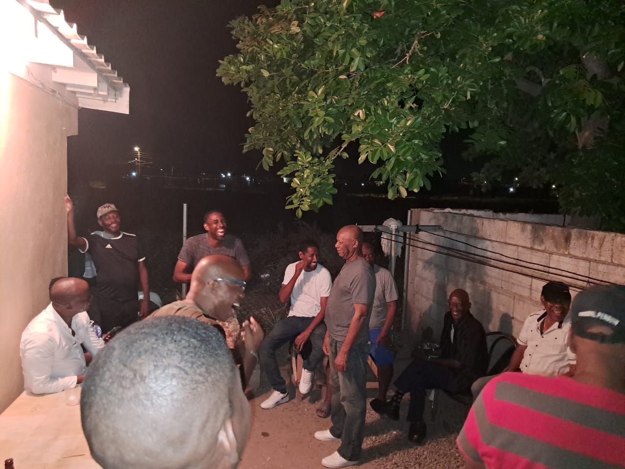 Men laughing together during a night of fellowship