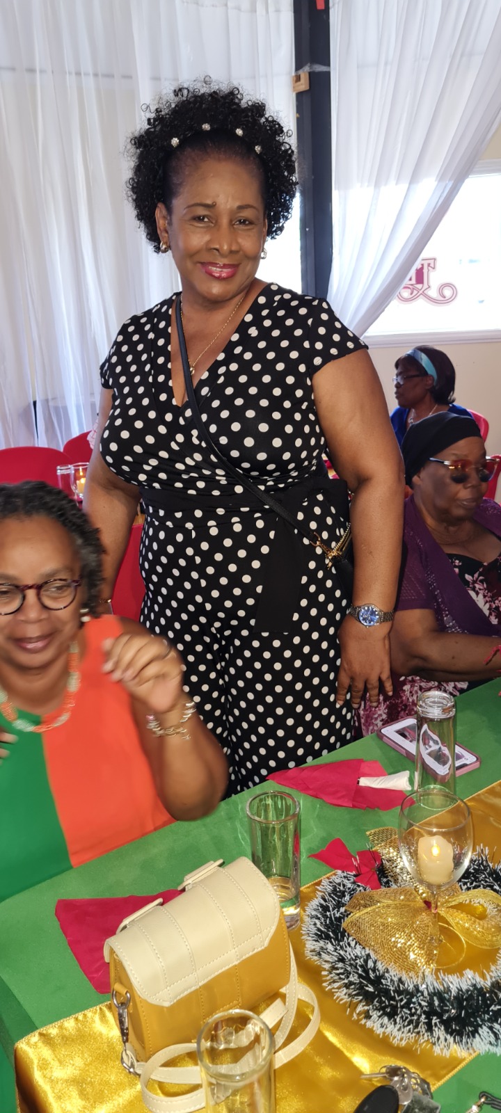 Woman smiling at a Women's Ministry Christmas banquet