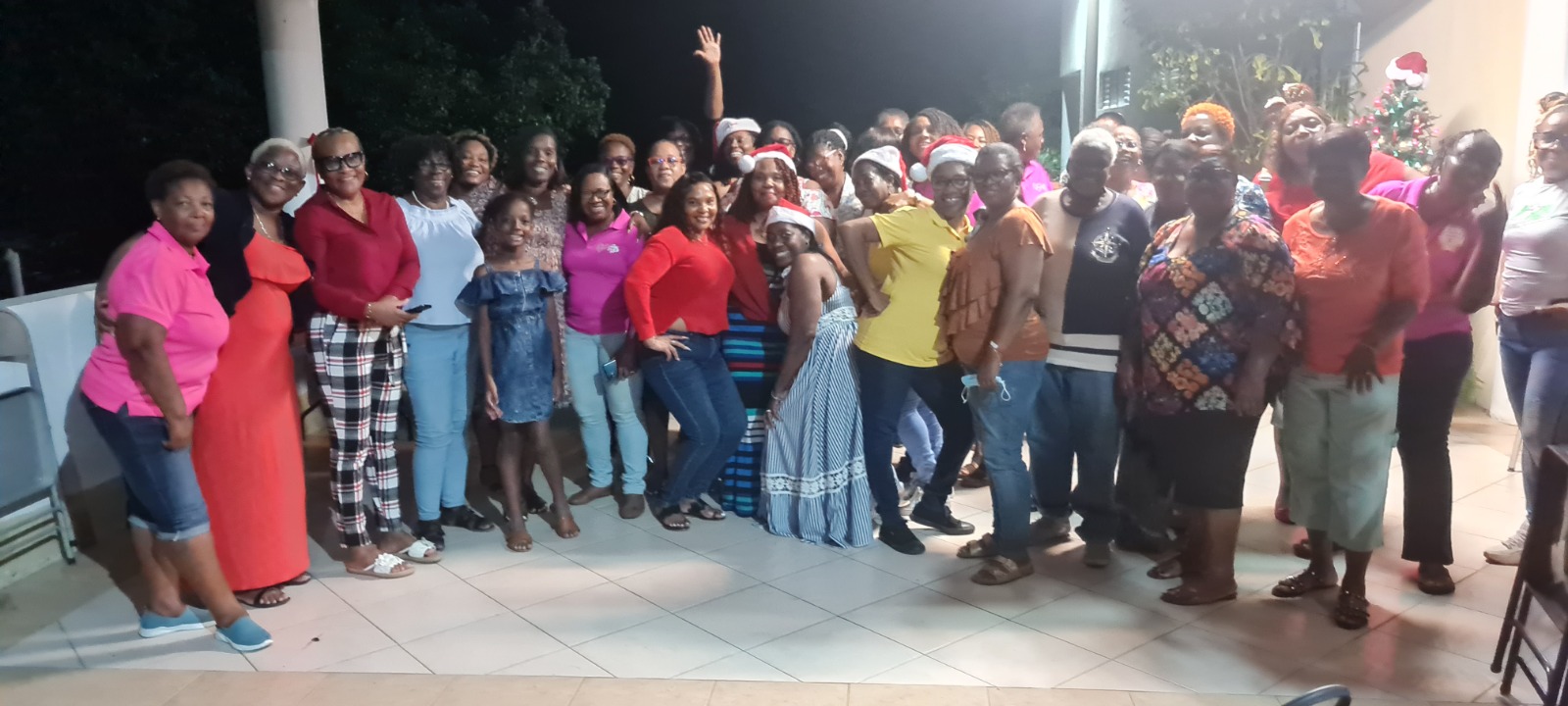 Women gathered outside for a Christmas fellowship group photo