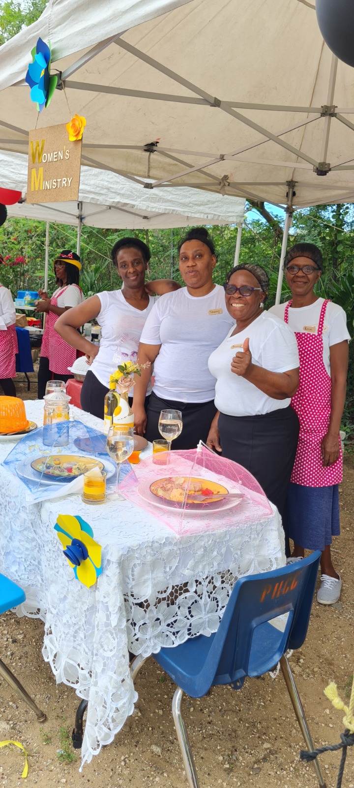 Women's Ministry team at a community showcase table