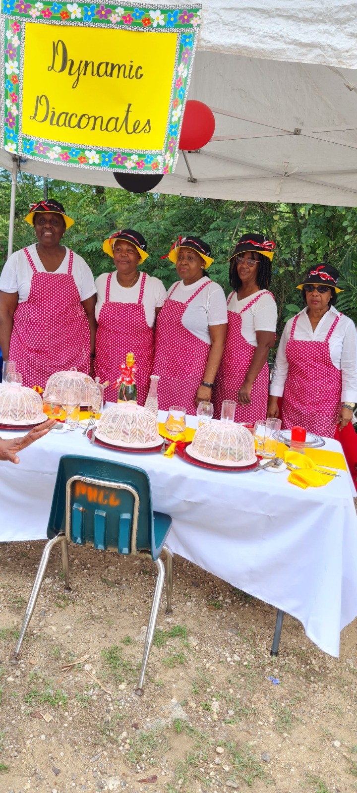 Dynamic Diaconates team standing behind their community showcase table